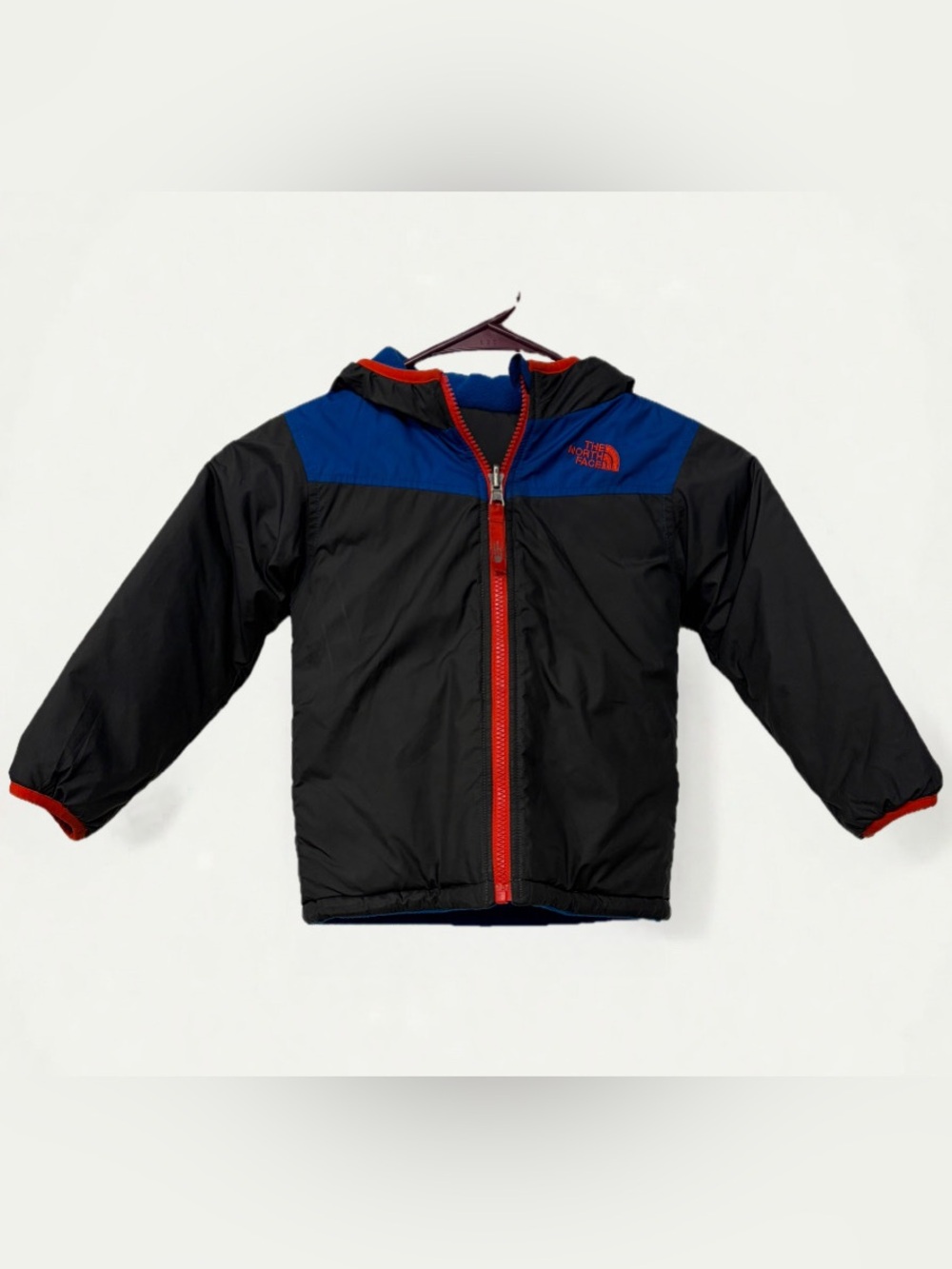 The North Face Kids Black Jacket with Blue Yoke and Red Trim